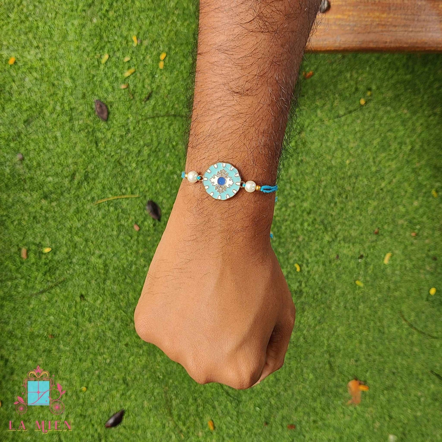 pastel blue rakhi hand shot