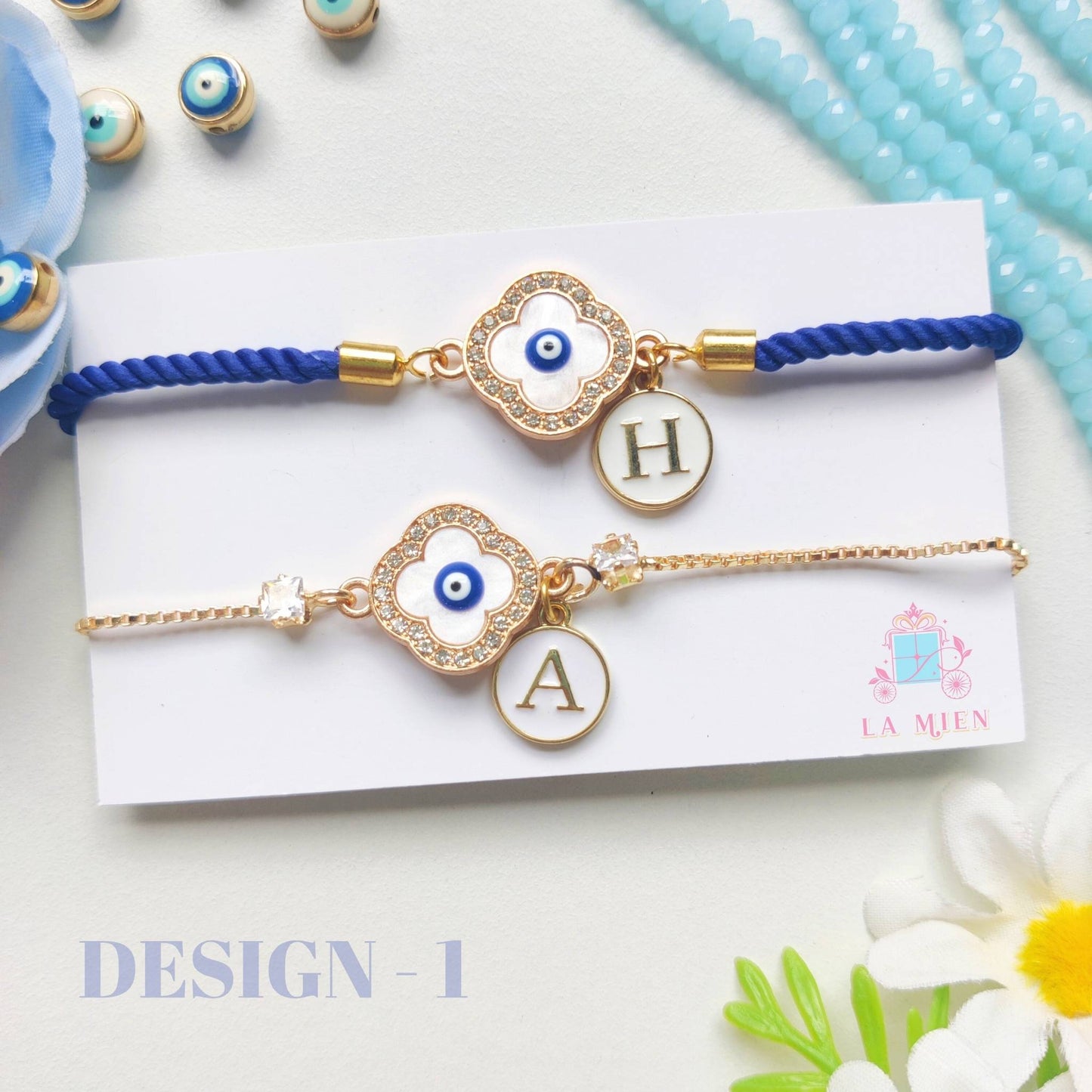 Personalized Bhaiya Bhabhi Evil Eye Rakhi Set – Blue cord for brother, golden chain for sister / sister-in-law with evil eye and initials tag – Design 1