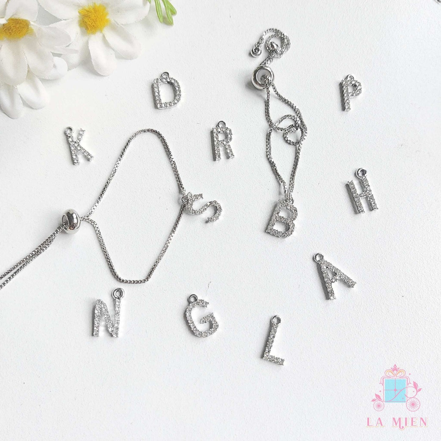 silver rakhi bracelet with custom initials and adjustable chain