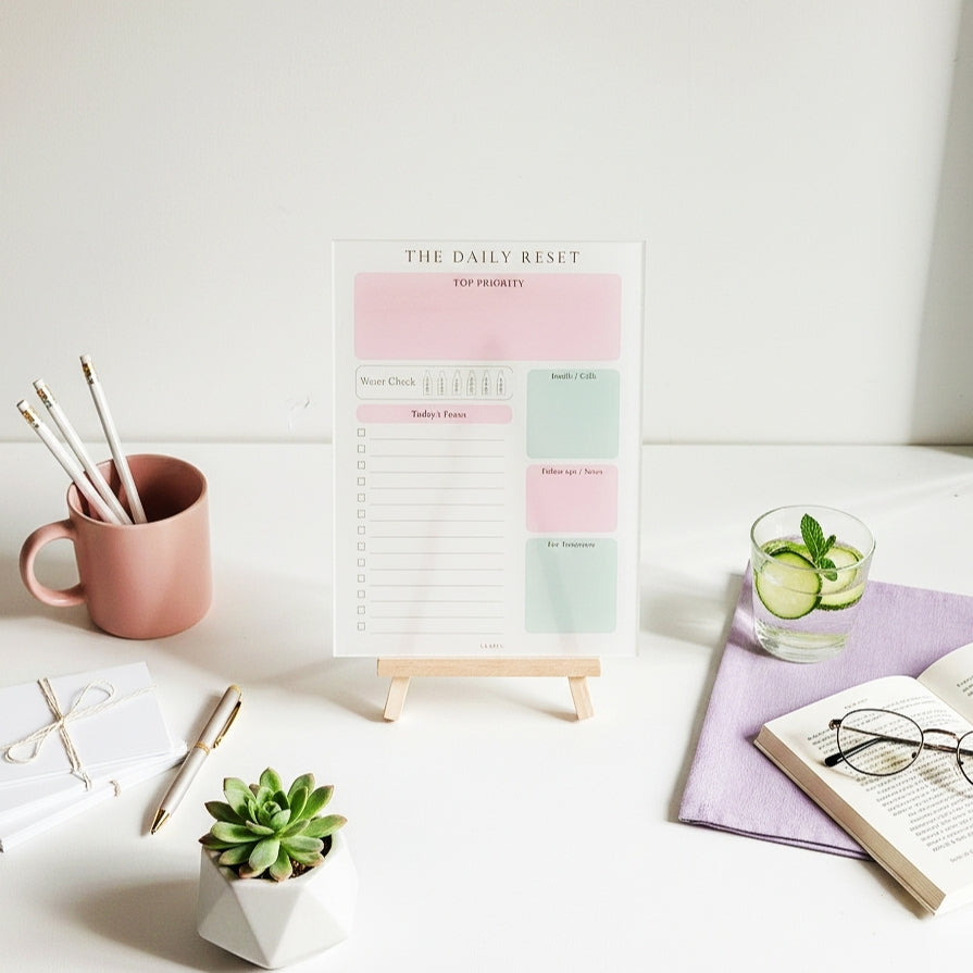 Aesthetic acrylic planner designed for corporate girls, featuring a clean daily reset layout for focus, planning, and productivity.