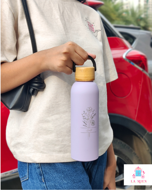 Aesthetic lavender thermos bottle with floral engraving and bamboo cap
