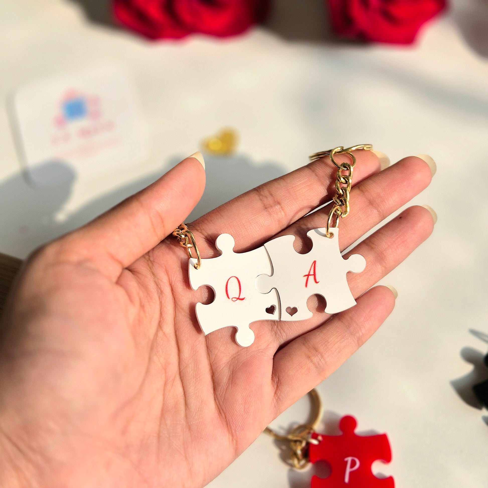 Close-up of personalised acrylic puzzle keychain with initials, elegant Galentine gift idea