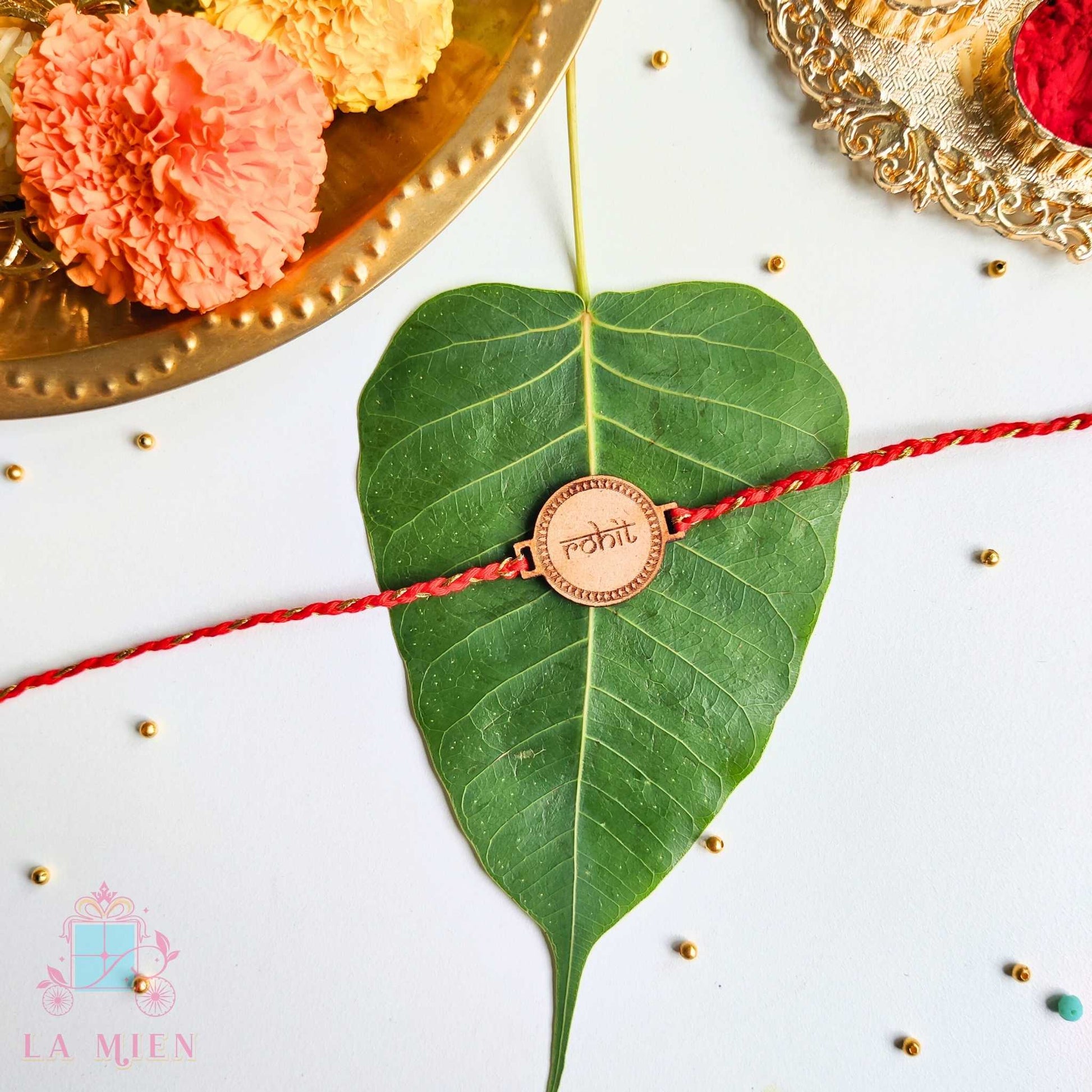 wooden finish rakhi with indian style name and red thread