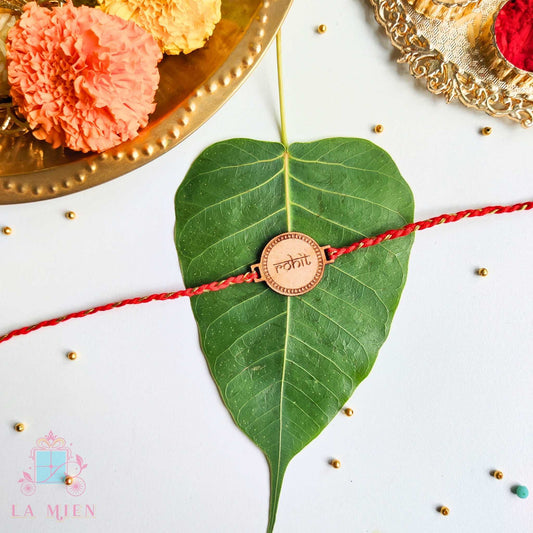 wooden finish rakhi with indian style name and red thread