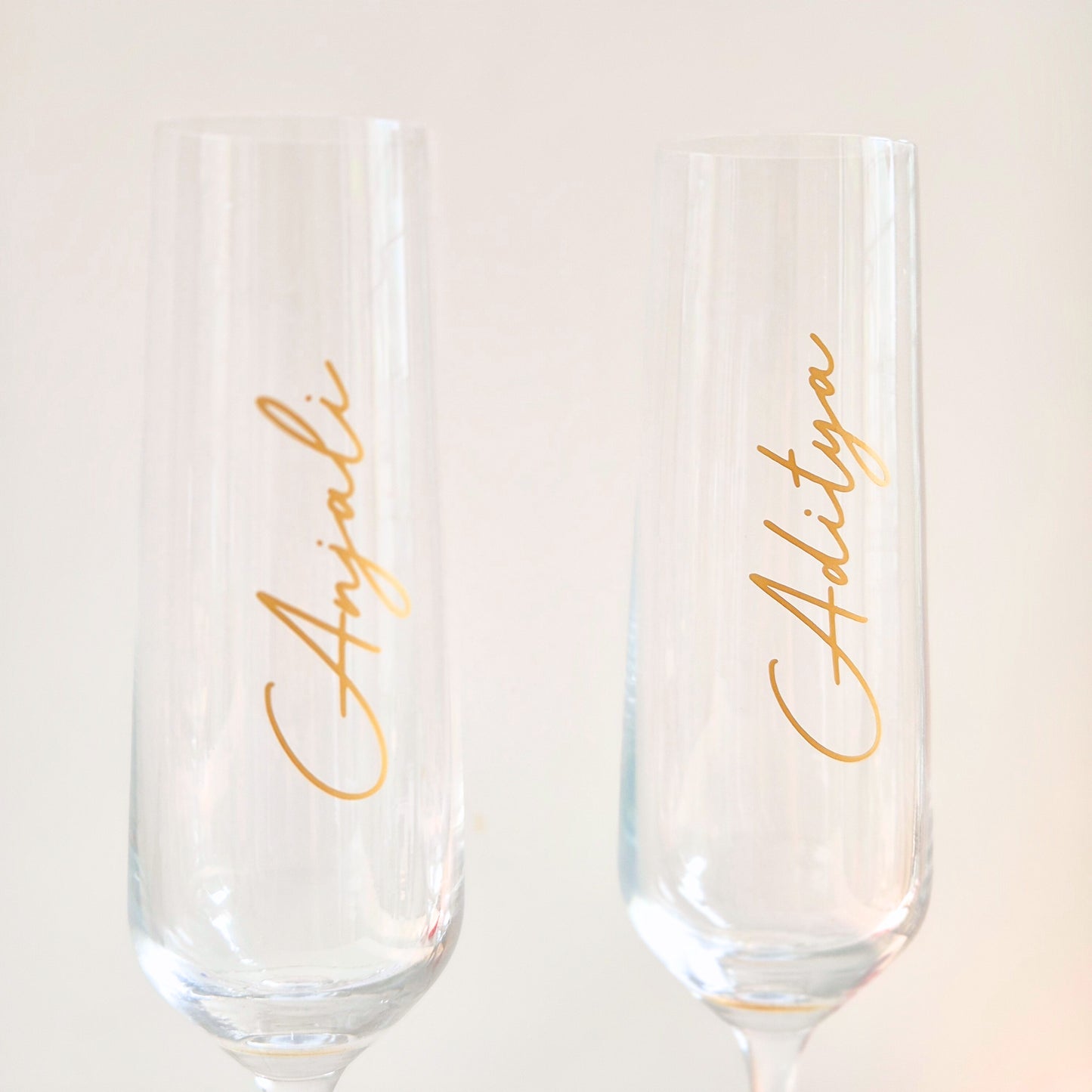 Elegant personalised champagne glass set styled for a romantic date night at home