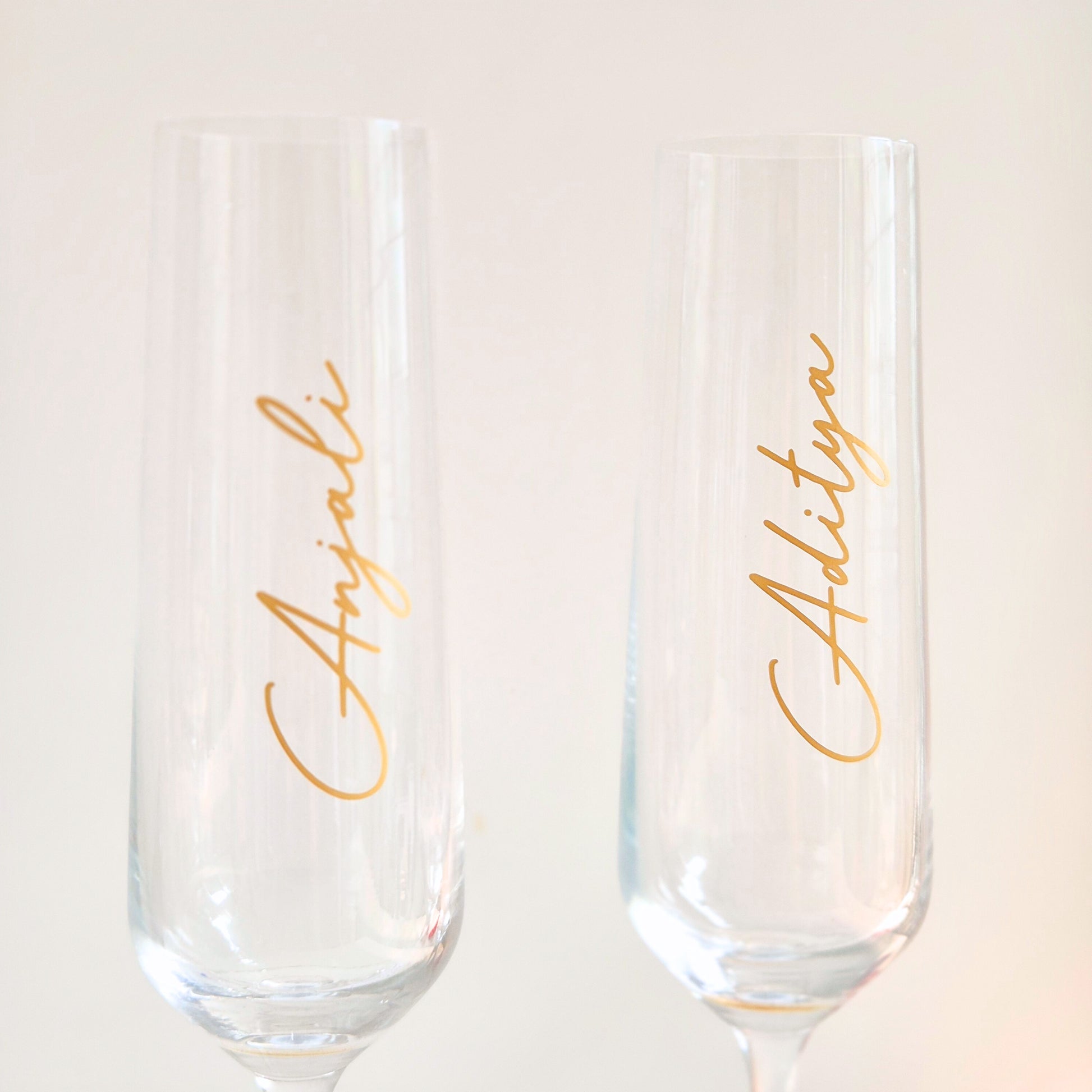 Elegant personalised champagne glass set styled for a romantic date night at home